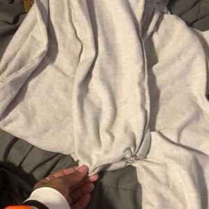 Grey romper long sleeve crunchie ware and bottom two pockets  off the shoulders